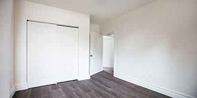 Additional bedroom with new closets and hardwood floor