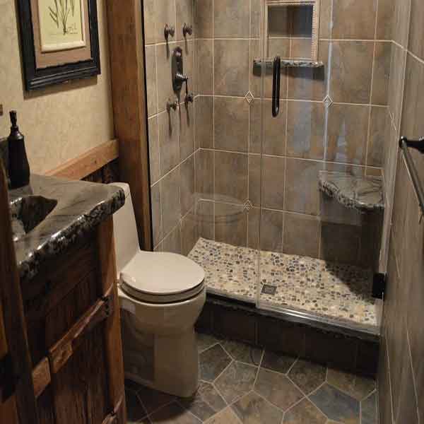 Custom tile floor in bathroom, as well as standing shower